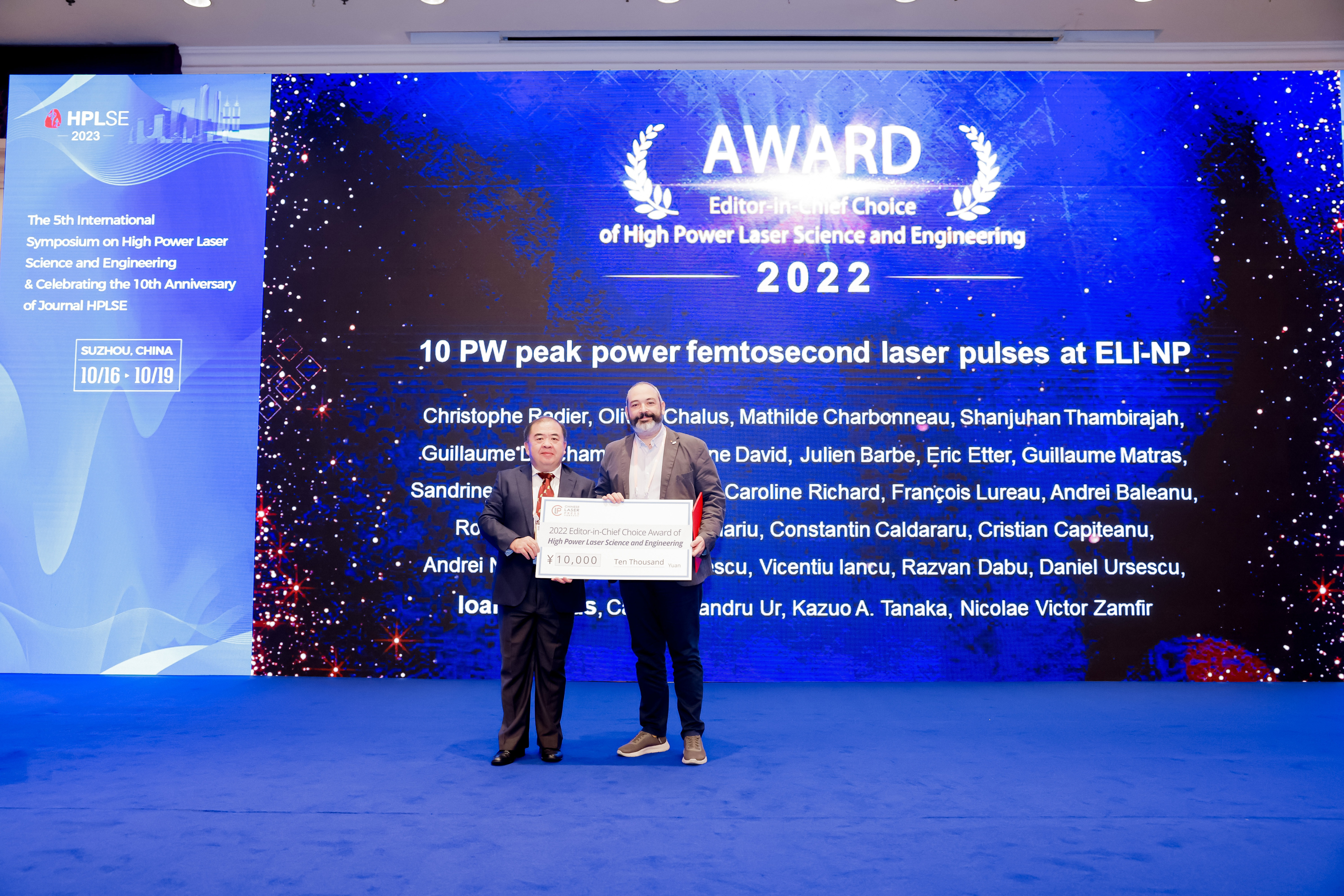 Photograph taken at the HPLSE2023 Symposium in Suzhou, China. Prof Jianqiang Zhu is (left) presenting the award to Prof Ioan Dancus (right).